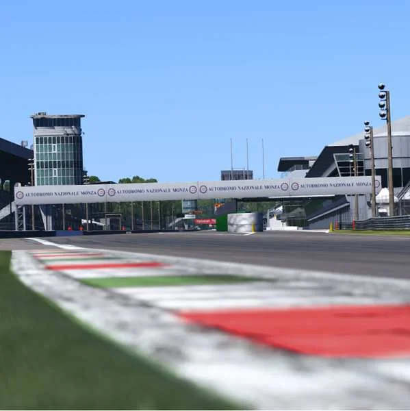 A sim racing view of the kerbs and pit tower at Monza